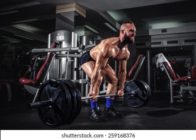 Muscular Man Doing Heavy Deadlift Exercise