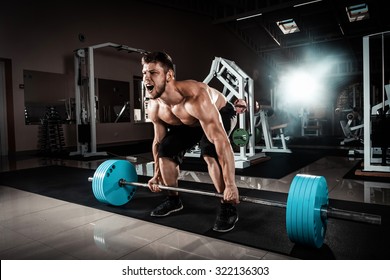 Muscular Man Doing Heavy Deadlift Exercise