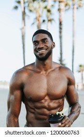 Muscular Man Drinking A Protein Shake