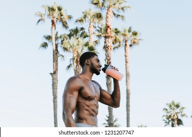 Muscular Man Drinking A Protein Shake