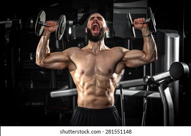 Muscular Man Lifting Some Dumbbells
