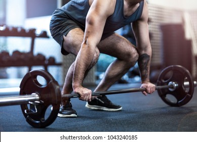 Muscular Man Lifting Weights