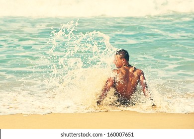 Muscular Man On The Beach 