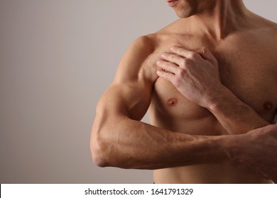 Muscular Man With Scar On His Shoulder After Surgery. Laser Scar Reduction Concept, Sport Exercising Injury