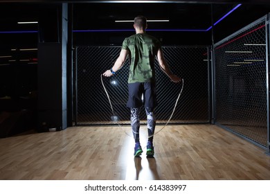 Muscular Man Skipping Rope