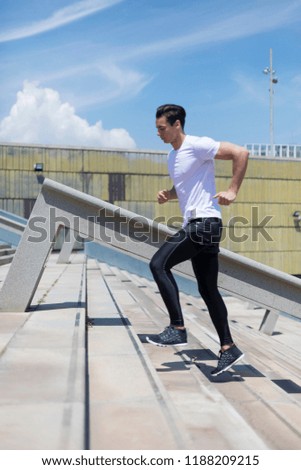 Similar – Athletic man warming up before running.