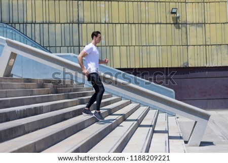 Similar – Happy man and jumping outdoors, warmup before jogging