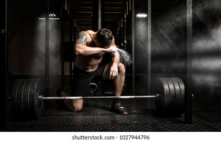 Muscular Man Workout With Barbell At Gym