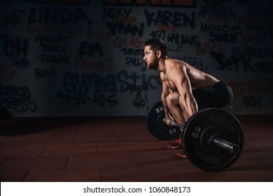 Muscular men lifting deadlift in the  crossfit  gym