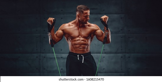 Muscular Men Training With Resistance Bands. Copy Space