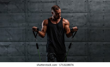 Muscular Men Training With Resistance Bands