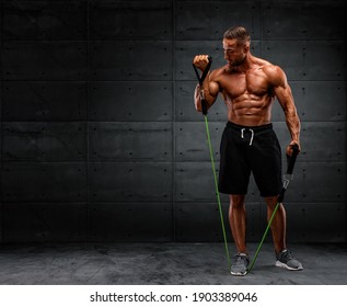 Muscular Men Training With Resistance Bands