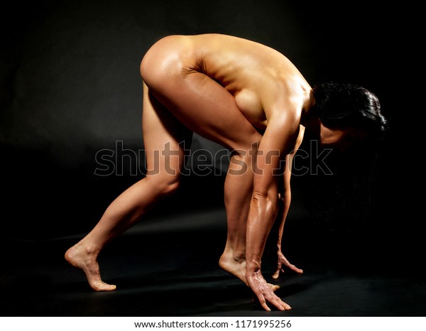 Image of seminude female bodybuilder posing