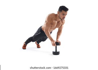 Muscular shirtless caucasian man training on floor using one dumbbell, isolated on white studio background. Close up of young sportsman building muscles, doing push ups. Concept of bodybuilding. - Powered by Shutterstock