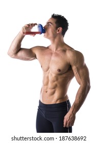 Muscular Shirtless Male Bodybuilder Drinking Protein Shake From Blender. Isolated On White, Looking At Camera