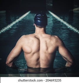 Muscular swimmer in a swimming pool