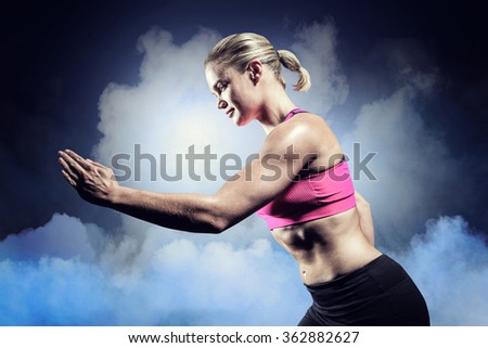 Similar – Rear view portrait of one young middle age athletic woman at crossfit training, exercising with trx suspension fitness straps over dark background