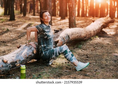 Muscular Woman Trains Triceps. Fit Woman In Military Sportswear Training In The Forest