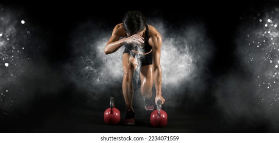 Muscular woman workout with kettlebell at gym - Powered by Shutterstock