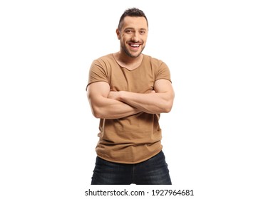 Muscular young man in t-shirt and jeans posing with crossed arms isolated on white background