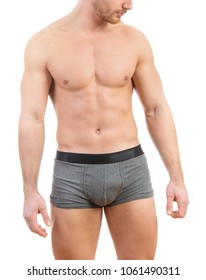 Muscular Young Man Wearing Boxer Briefs Isolated On White Background.