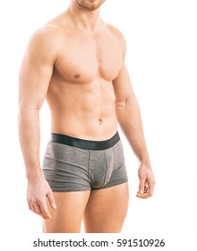 Muscular Young Man Wearing Boxer Briefs Isolated On White Background.