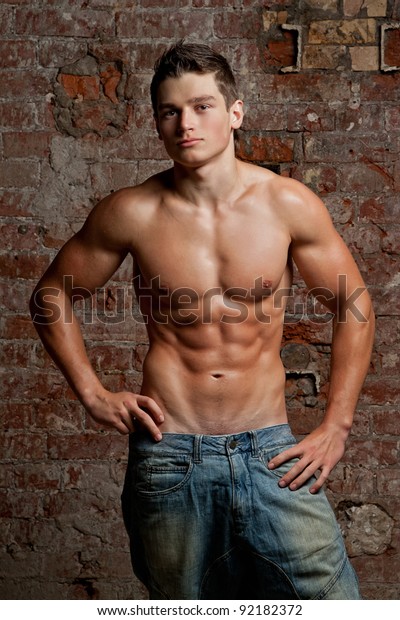 Muscular Young Naked Sexy Boy Posing In Jeans On The 