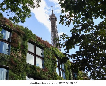 Musee Du Quai Branly - Jacques Chirac, PARIS-AUGUST 8, 2021: The Museum And The Eiffel Tower Under The Blue Sky And White Clouds