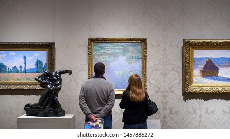 The Museum Of Fine Arts, Boston, Massachusetts, United States Of America - Jan 9 2015: Vistiors Looking At Art Works Of Claude Monet, A Founder Of French Impressionist Painting. Impressionism. Couple.