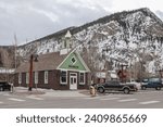 Museum in Frisco, Colorado, on a snowy day. Picturesque north american city in the heart of rockies. Some traffic visible.