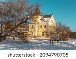 Museum of the River Daugava the Dole manor build in classicism style with bricks and small tower in park in winter