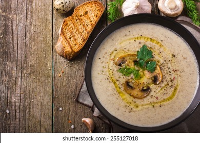 Mushroom Cream Soup On Rustic Background, Top View