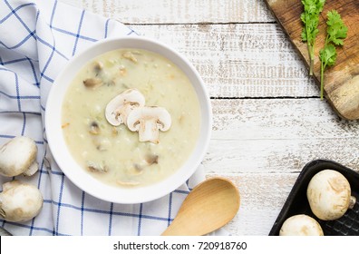 Mushroom Cream Soup On White Wooden Board. Top View