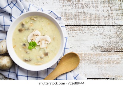 Mushroom Cream Soup On White Wooden Board. Top View