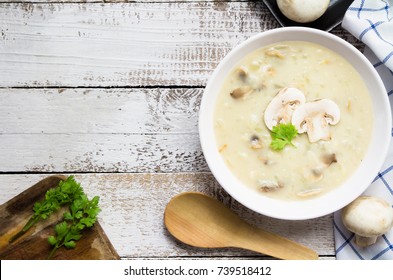 Mushroom Cream Soup On White Wooden Board. Top View