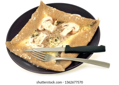 Mushroom Galette On A Plate On A White Background