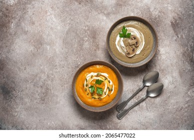 Mushroom And Pumpkin Cream Soup On A Brown Grunge Background. Warm Winter Soup. Top View, Flat Lay. Healthy Vegetarian Food Concept. Textured Object.