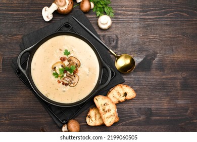 Mushroom soup and fresh mushrooms on a wooden background , autumn seasonal cream soup with vegetables  - Powered by Shutterstock