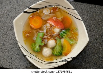 Mushroom Soup, Meatballs, And Vegetables With A Sprinkling Of Fried Shallots. Nutritious And Healthy Food. Indonesian Food. Carrot, Sliced Tomato, Broccoli. 