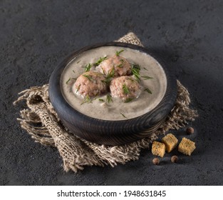 Mushroom Soup Puree With Meatballs, Dill And Croutons In A Wooden Bowl On A Linen Napkin On A Dark Gray Background In Rustic Style