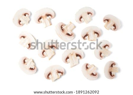 mushrooms champignons sliced into slices isolated on white background