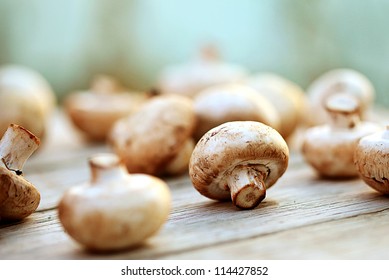 Mushrooms on a wooden table. Macro image. - Powered by Shutterstock