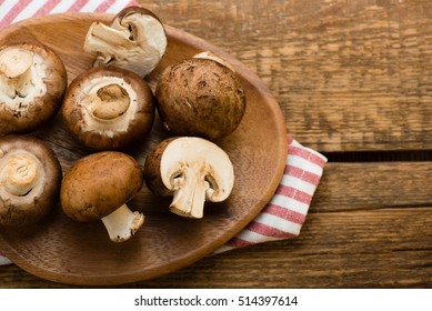 Mushrooms on a wooden table. Top view.