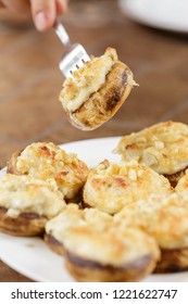 Mushrooms Stuffed With Crab And Cheese On White Plate