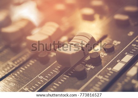 Music audio system concept in vintage style. Sound mixer buttons control with black and white sound mixer buttons in recording room . Selective focus.