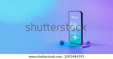 Music background. Mobile smartphone screen with music application, sound headphones. Audio voice with radio beats on neon gradient. Recording studio or podcasting banner with copy space