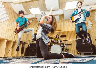 Music Band Having Fun Performing On A Stage