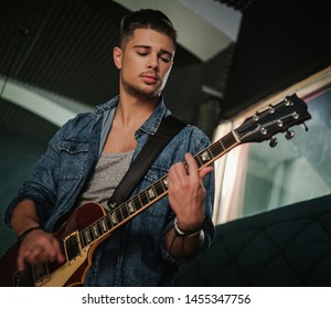 Music Band Having Rehearsal In A Studio