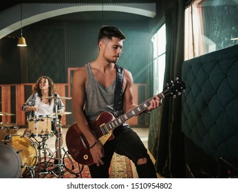 Music band having rehearsal in a studio - Powered by Shutterstock