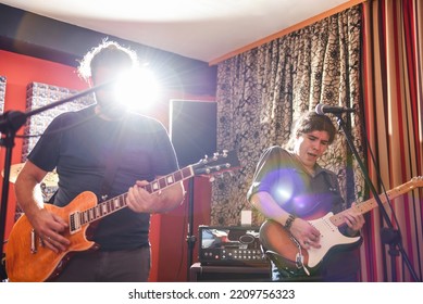 Music Band Performing In Modern Recording Studio